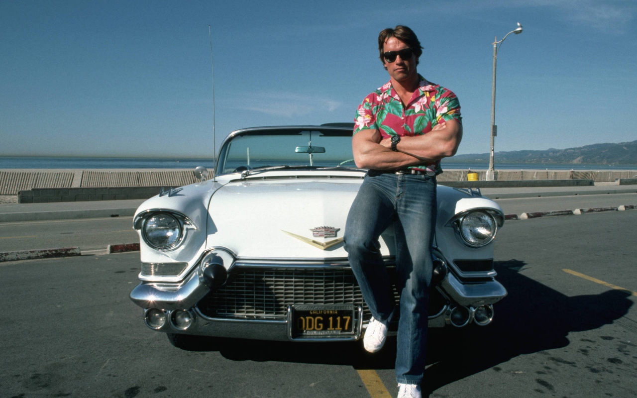 Cadillac and Arnold Schwarzenegger for 1280 x 800 widescreen resolution