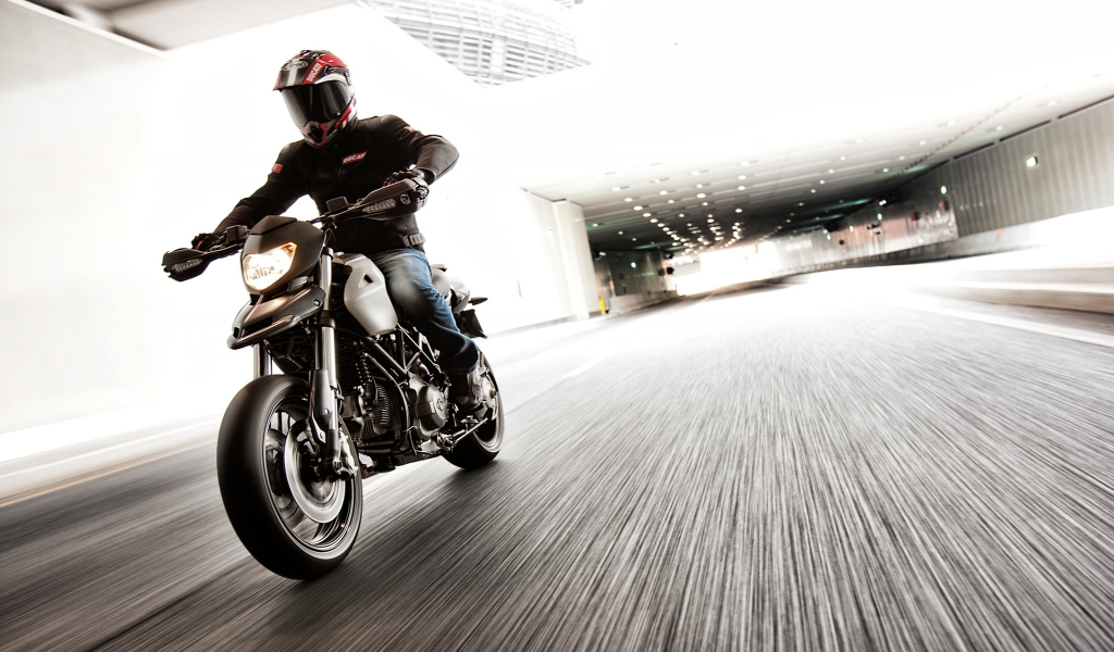 Ducati Motorcycle Rider for 1024 x 600 widescreen resolution