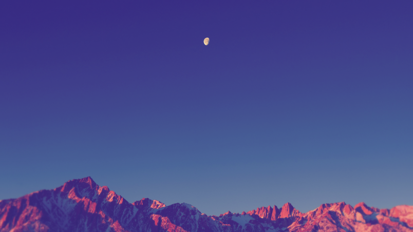 Download A Purple And Blue Background With A Mountain And Mountains