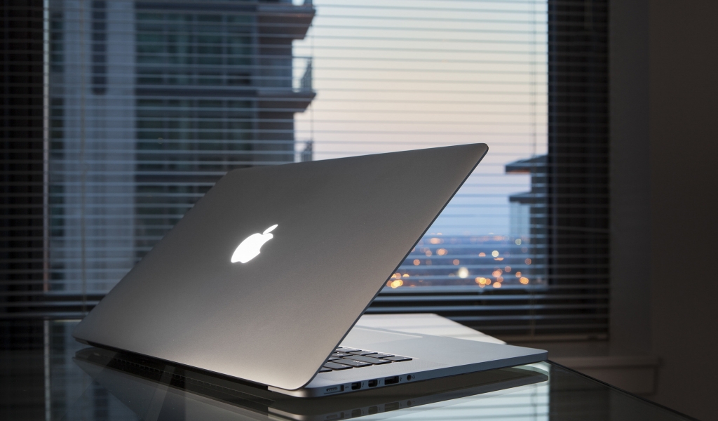 Apple MacBook On Desk for 1024 x 600 widescreen resolution