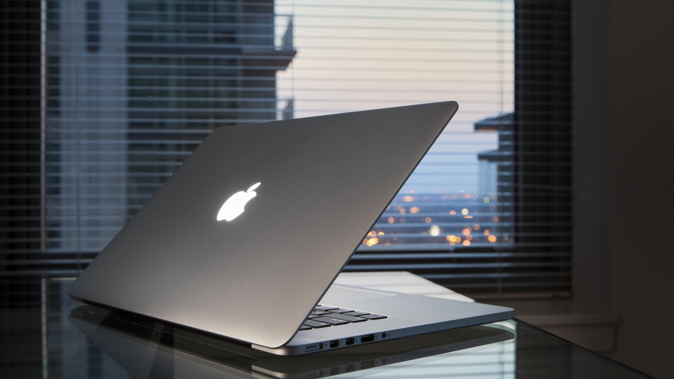 Apple MacBook On Desk for 1366 x 768 HDTV resolution