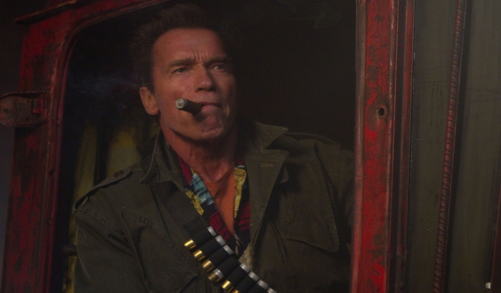 Arnold Schwarzenegger Cigar for 1024 x 600 widescreen resolution
