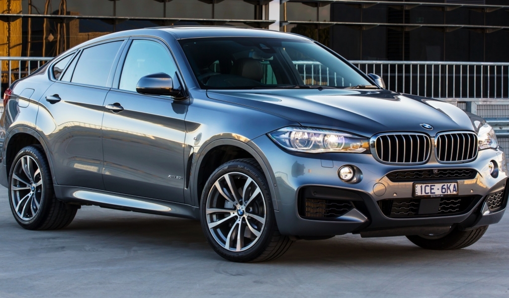 Black BMW X6 M50D for 1024 x 600 widescreen resolution