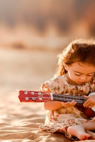 Cute Little Girl Playing Guitar for 320 x 480 iPhone resolution