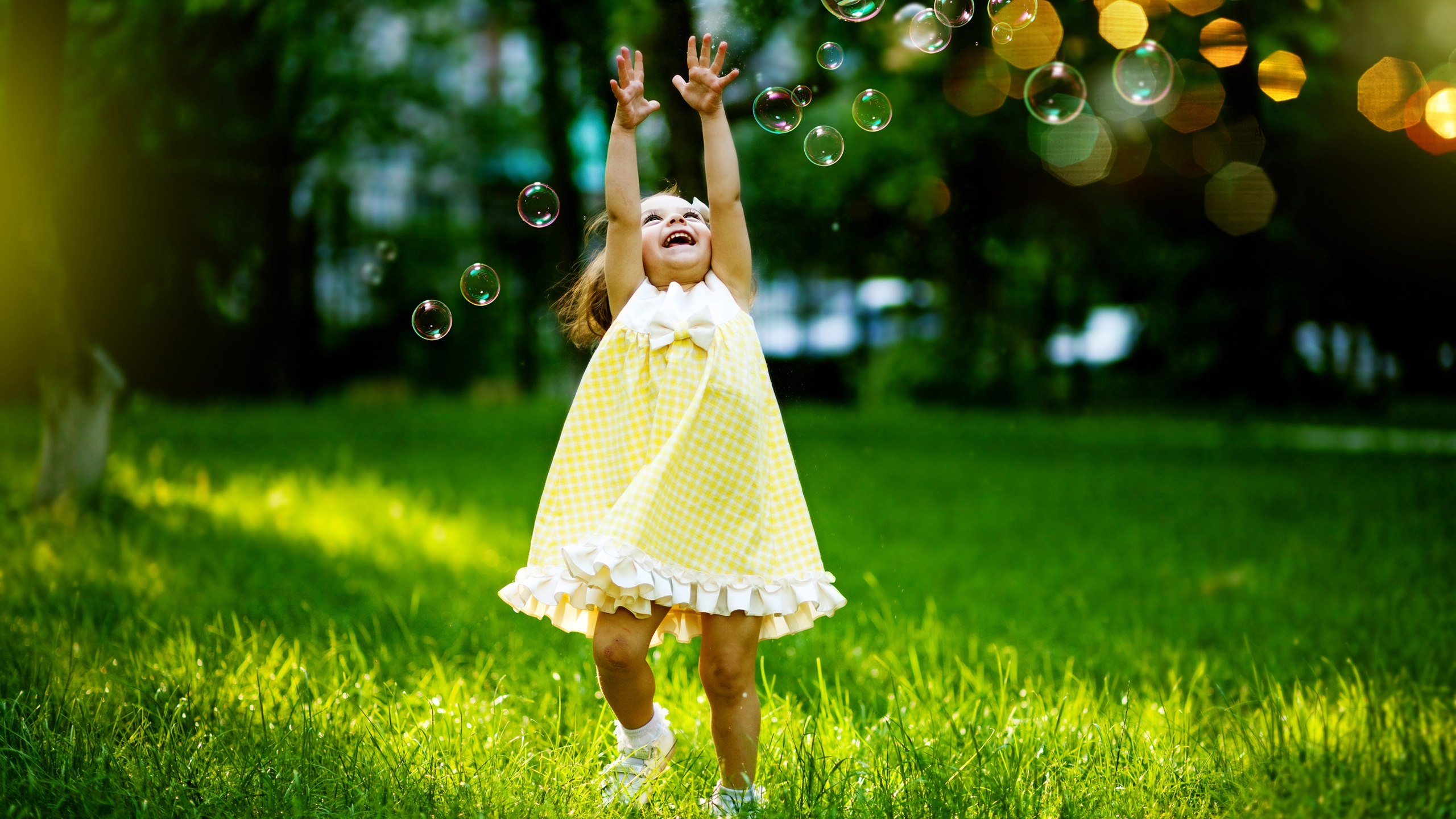 Little Girl Playing with Bubbles for 2560x1440 HDTV resolution