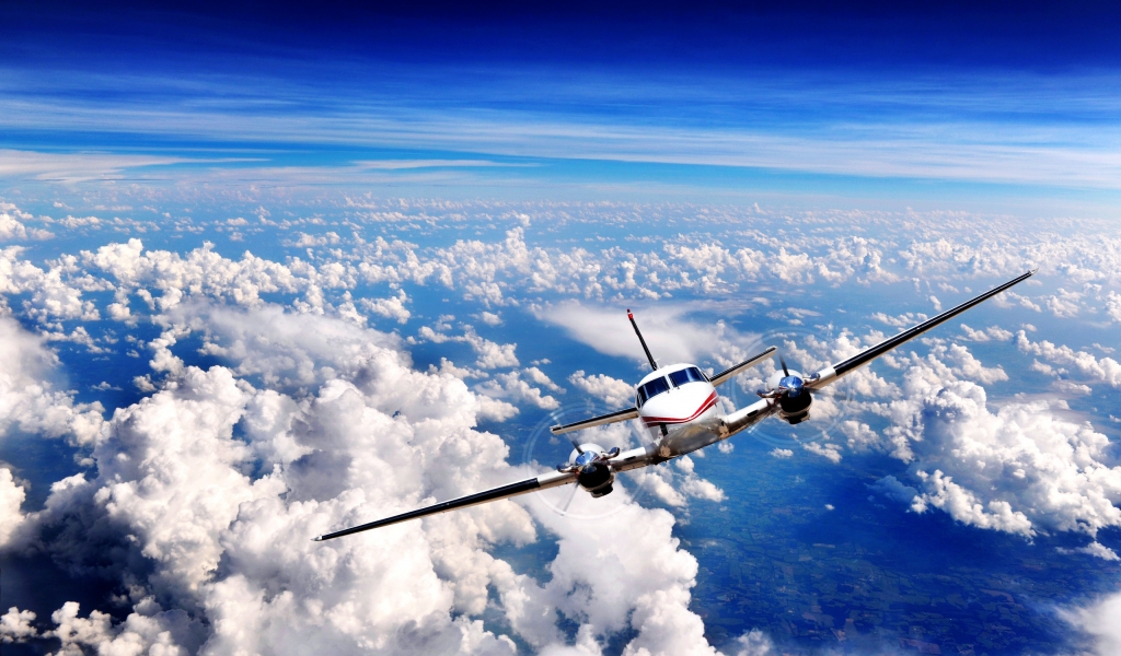 Plane over the Clouds for 1024 x 600 widescreen resolution